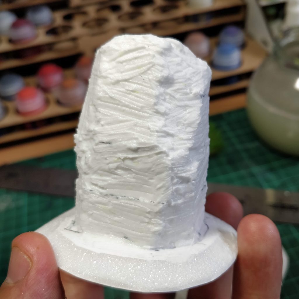 A standing stone covered in modelling paste
