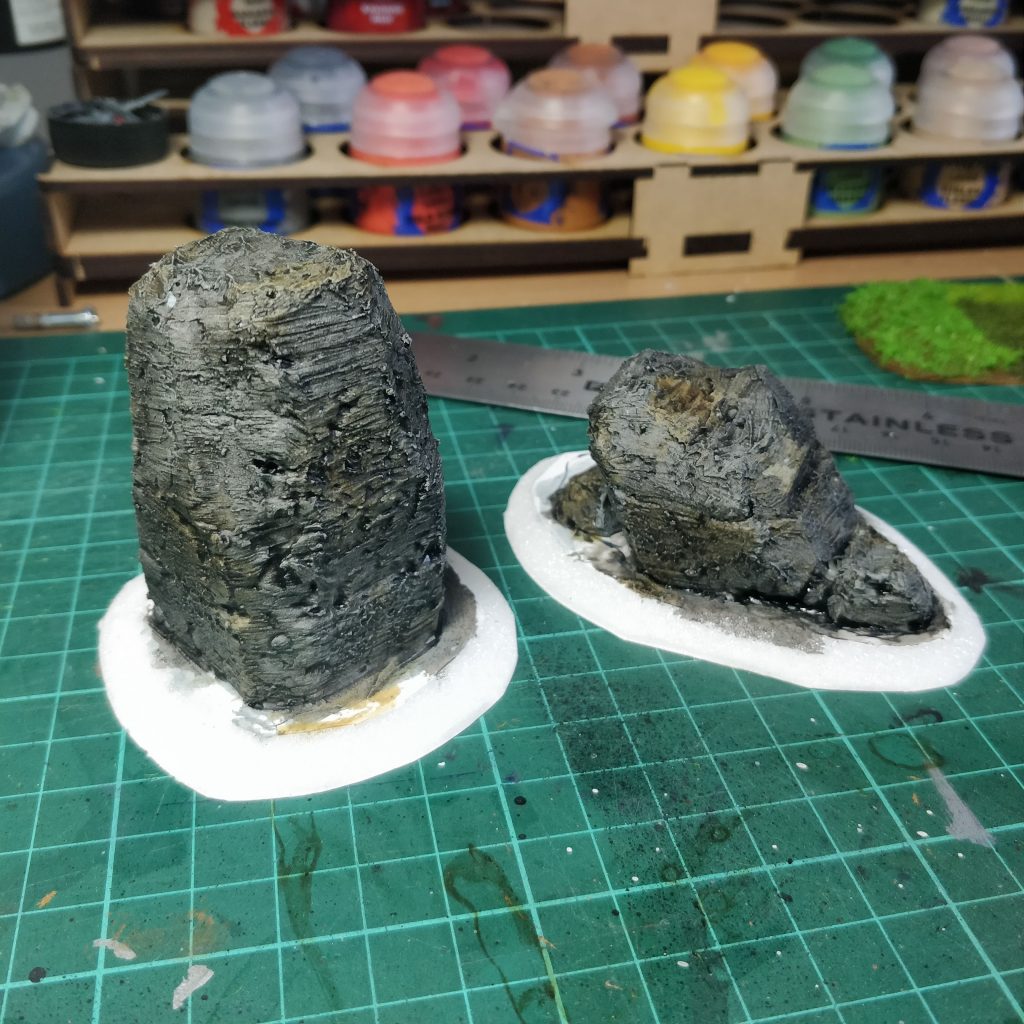 Standing stones with a black wash applied